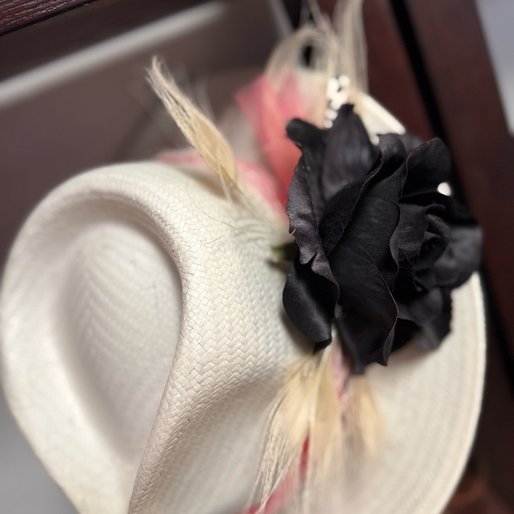Elegant White Hat with Black Floral Accent